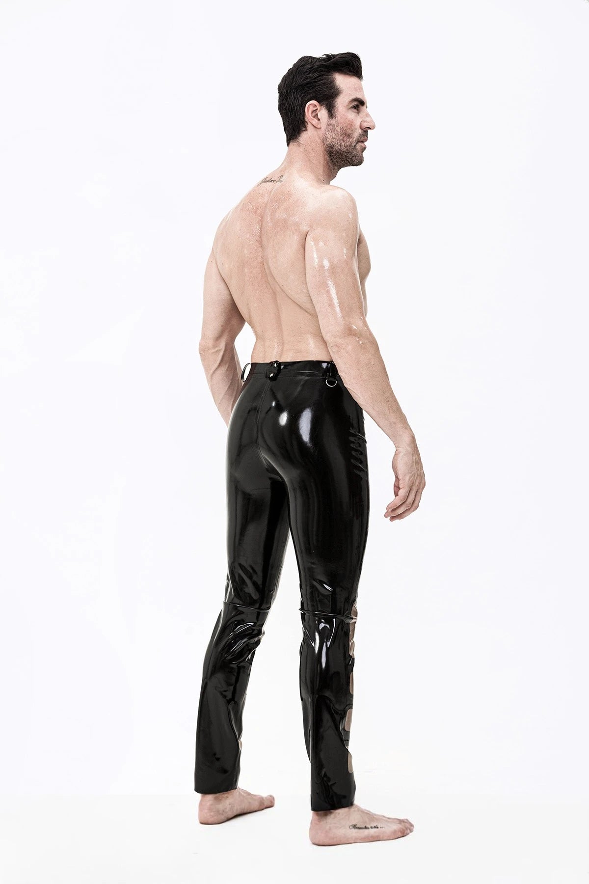 Black, trim color is Male Latex Panelled Romper Pants