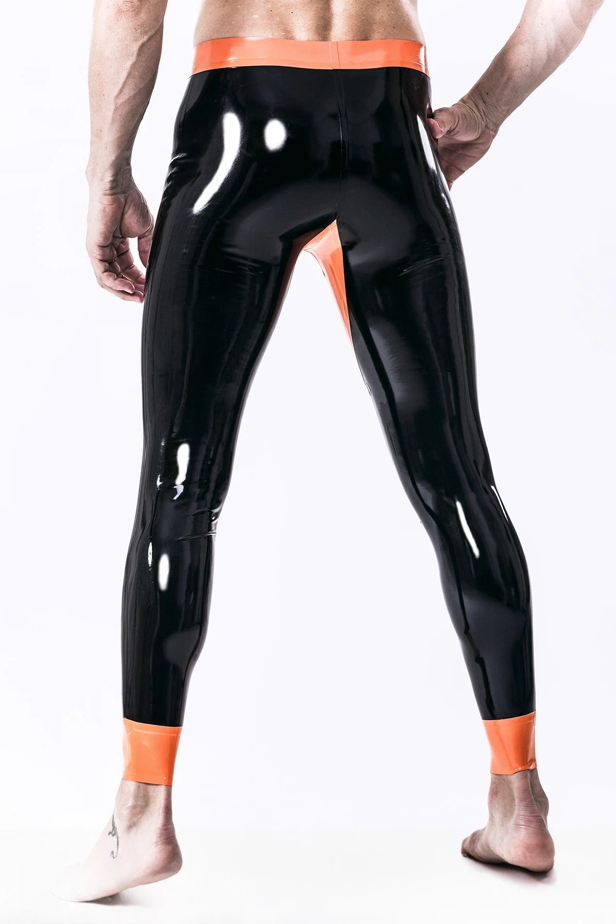 Black, trim color is orange Male 'Penny Pocket' Latex Leggings