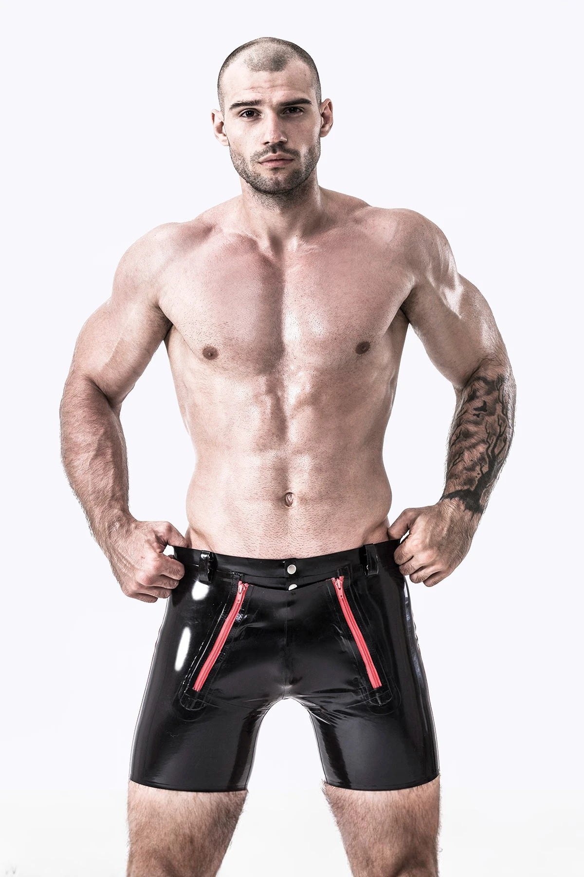 Black, trim color is Red Male Latex Front Double Zip Shorts