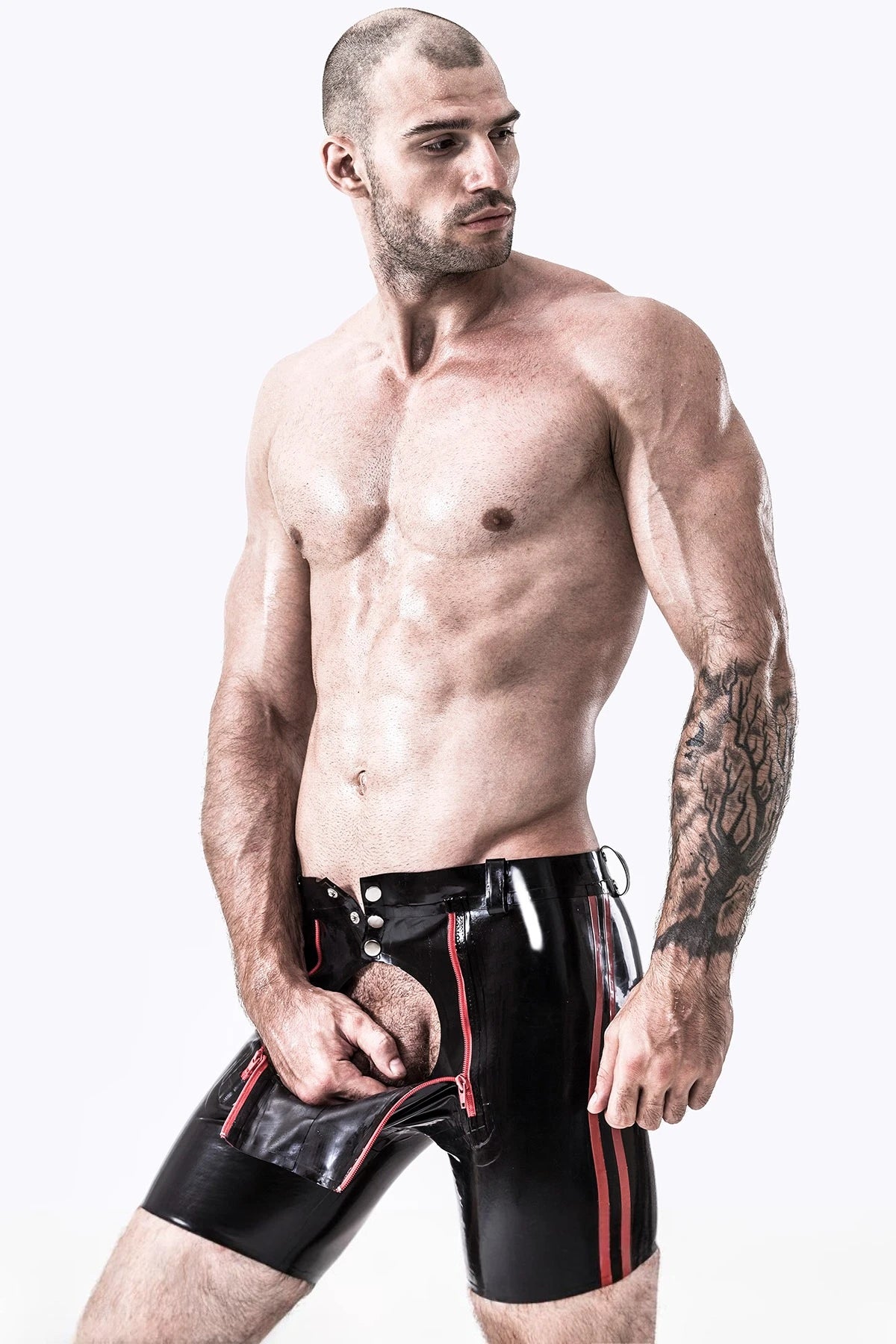 Black, trim color is Red Male Latex Front Double Zip Shorts