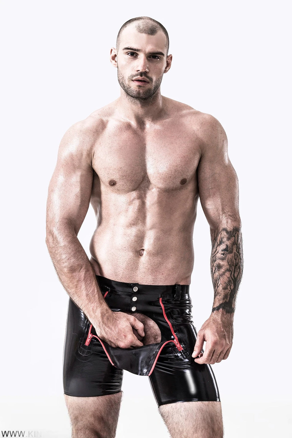 Black, trim color is Red Male Latex Front Double Zip Shorts