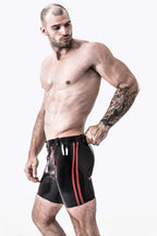 Black, trim color is Red Male Latex Front Double Zip Shorts