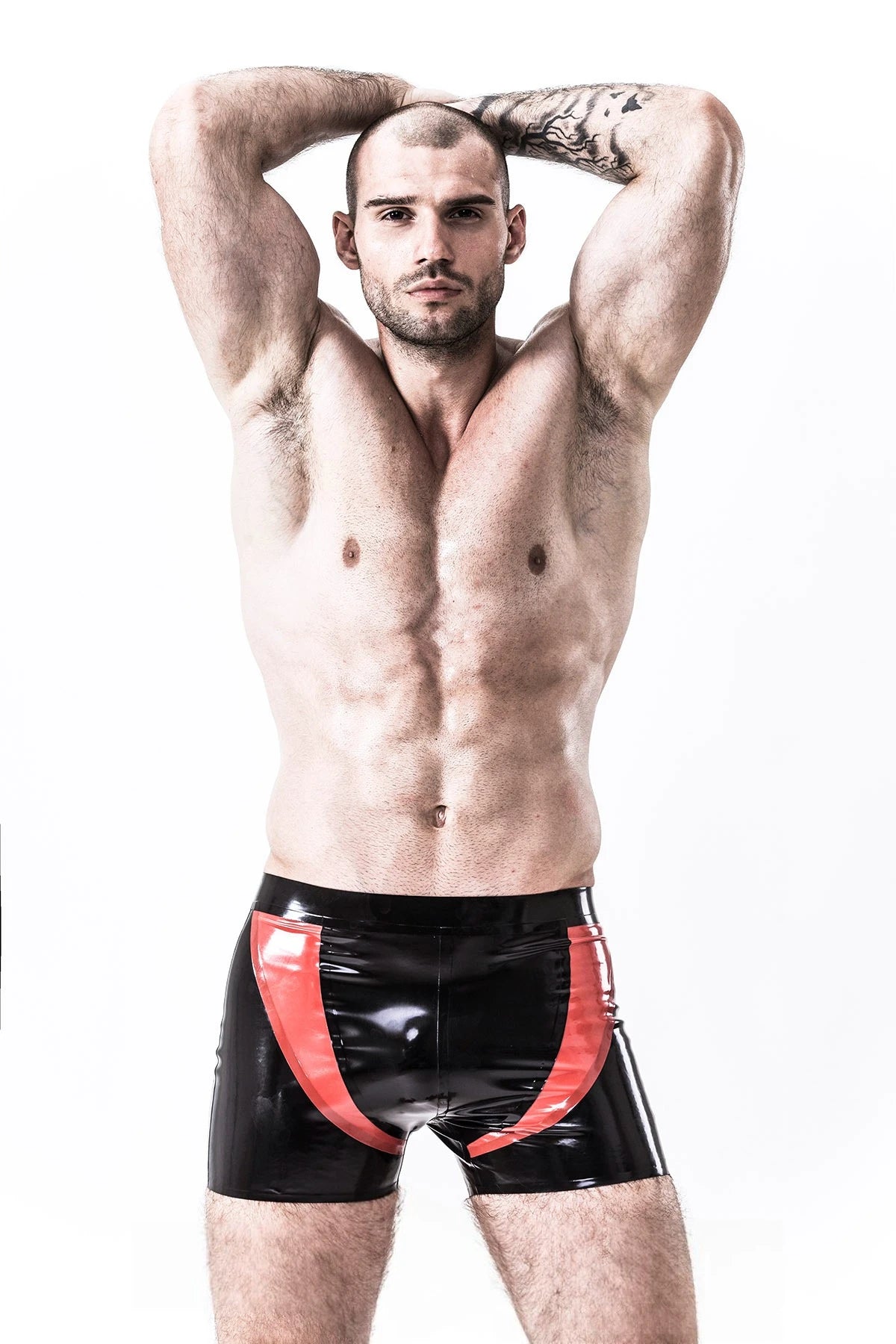 Black, trim color is Red Male 'U-Curve' Latex Shorts