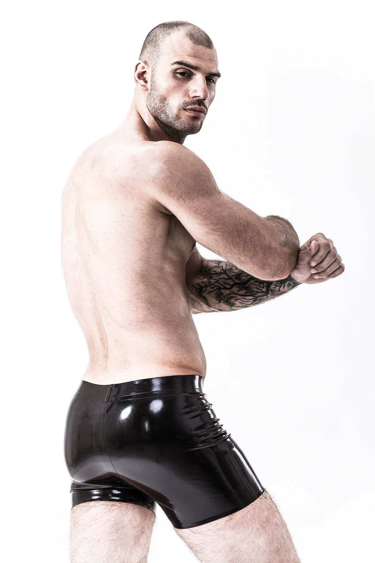 Black, trim color is Red Male 'U-Curve' Latex Shorts